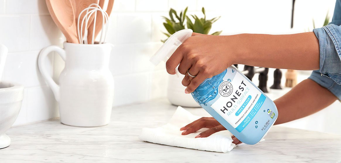 Person Cleaning Countertop Person Cleaning Countertop